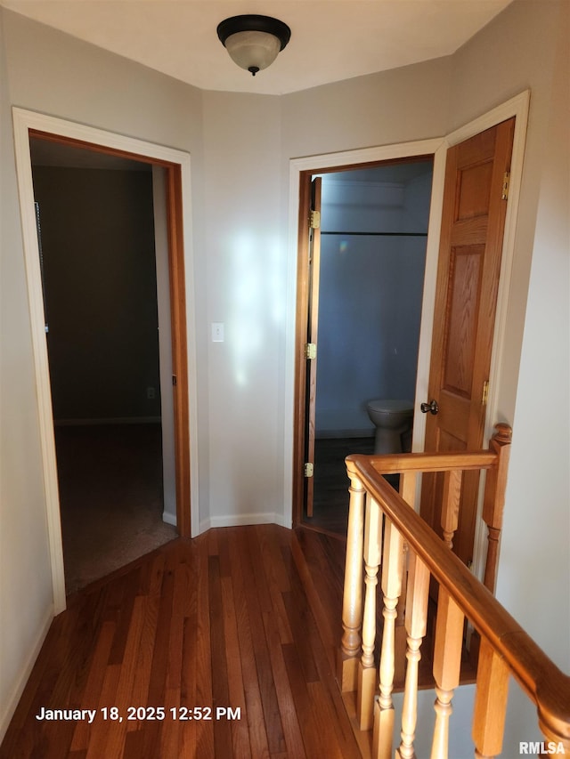 corridor with dark wood-type flooring