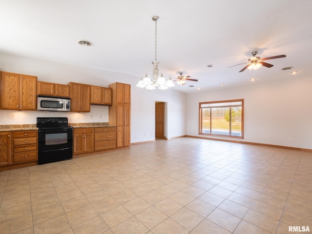 kitchen featuring lofted ceiling, black electric range oven, hanging light fixtures, light tile patterned floors, and ceiling fan with notable chandelier