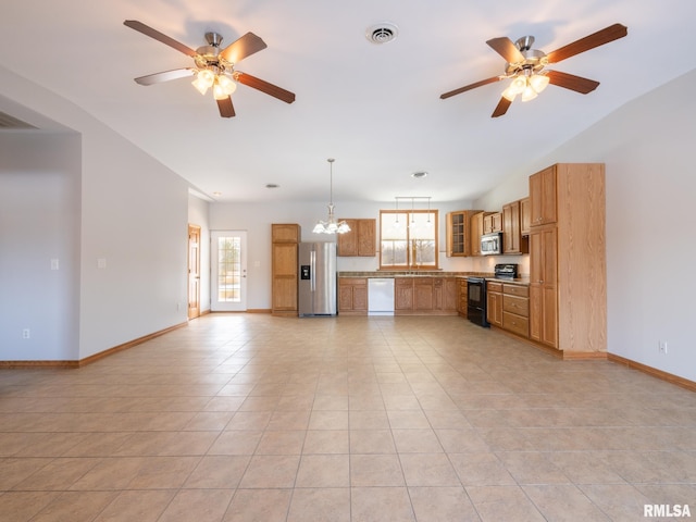 kitchen with light tile patterned floors, appliances with stainless steel finishes, ceiling fan with notable chandelier, and hanging light fixtures