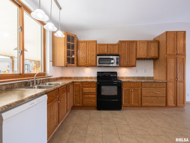 kitchen featuring dishwasher, pendant lighting, light tile patterned flooring, sink, and black / electric stove