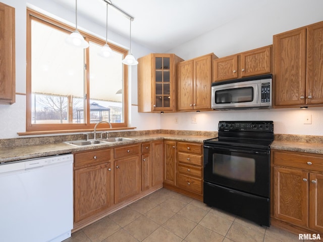 kitchen with rail lighting, dishwasher, black range with electric cooktop, pendant lighting, and sink