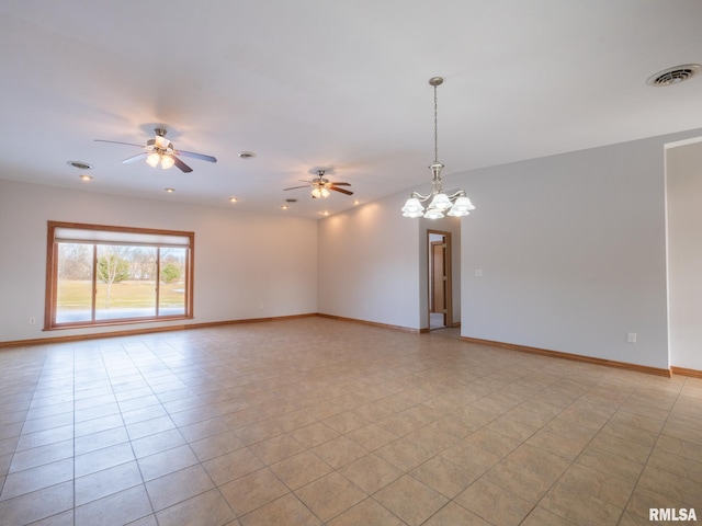 tiled empty room featuring ceiling fan with notable chandelier