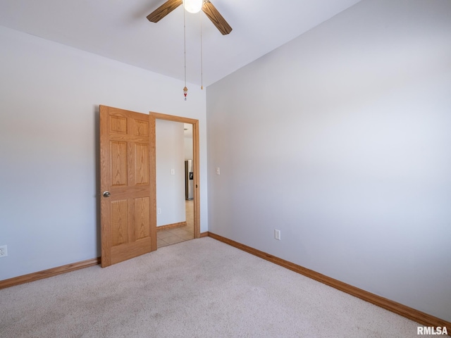 empty room featuring light carpet and ceiling fan