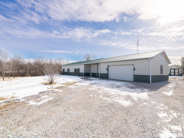 exterior space featuring a garage and an outdoor structure