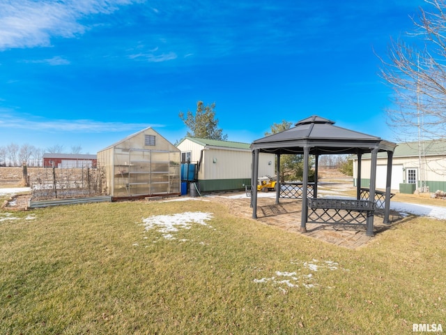 view of yard with a gazebo and an outdoor structure