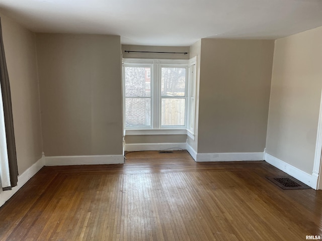 unfurnished room featuring hardwood / wood-style floors