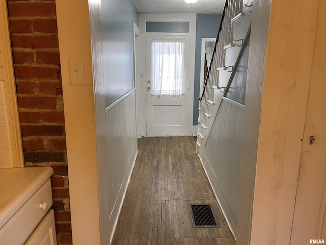 corridor featuring dark hardwood / wood-style flooring