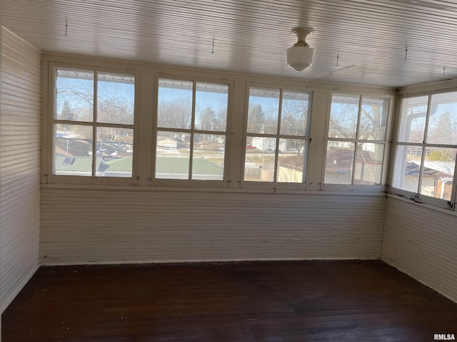 unfurnished sunroom with wood ceiling