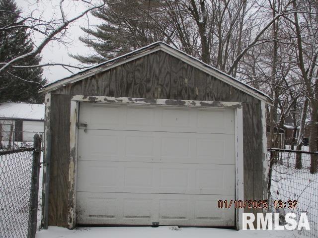 view of snow covered garage