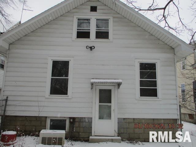 back of house with cooling unit