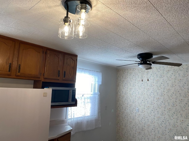 kitchen featuring ceiling fan and white fridge