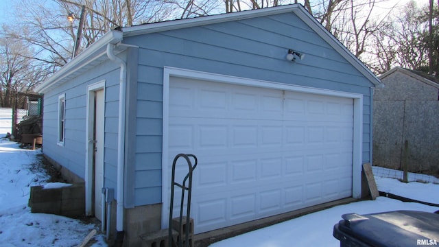 view of snow covered garage