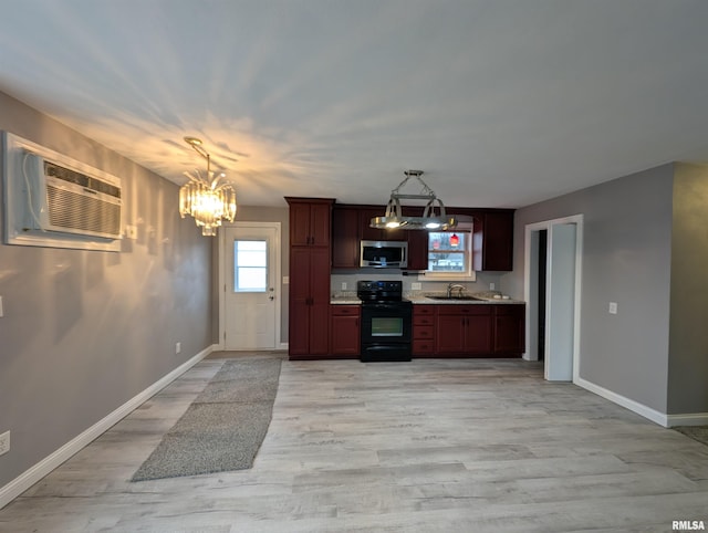 kitchen with decorative light fixtures, light hardwood / wood-style floors, sink, a notable chandelier, and electric range