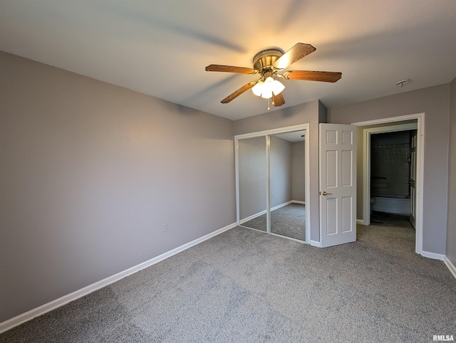 unfurnished bedroom with ceiling fan, a closet, and carpet flooring