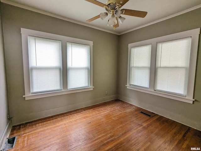 empty room with ceiling fan, light hardwood / wood-style flooring, and crown molding