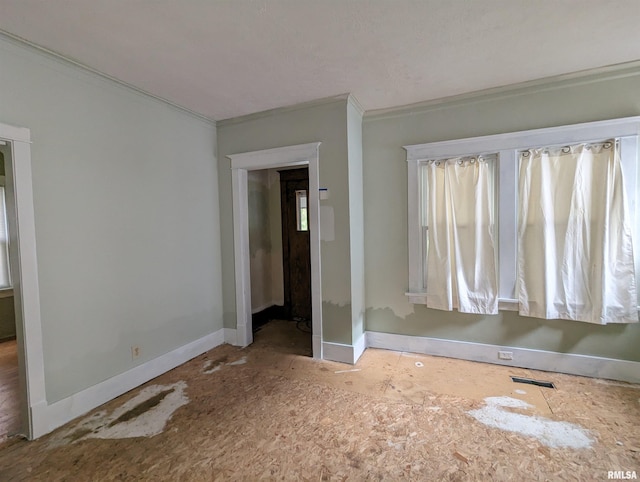 unfurnished bedroom with crown molding