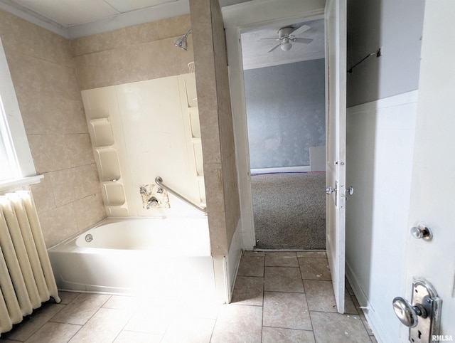 bathroom featuring ceiling fan, shower / bathtub combination, and radiator heating unit