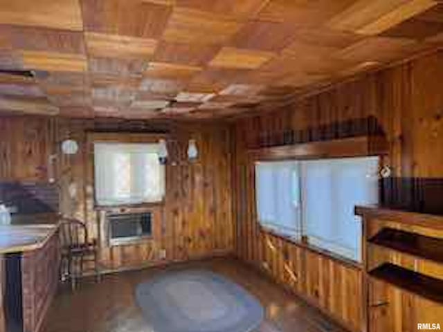 living room featuring wood ceiling and wooden walls