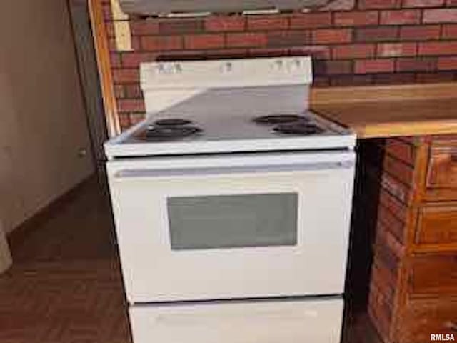 kitchen featuring white range with electric stovetop