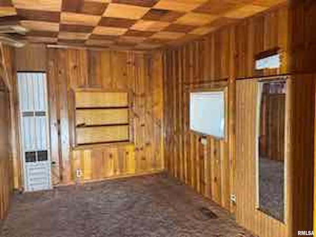 interior space featuring wood walls