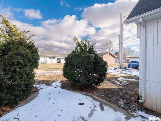 view of yard covered in snow