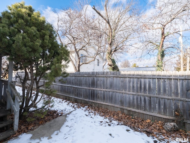 view of snow covered gate