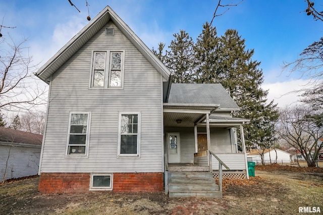 rear view of property with a porch