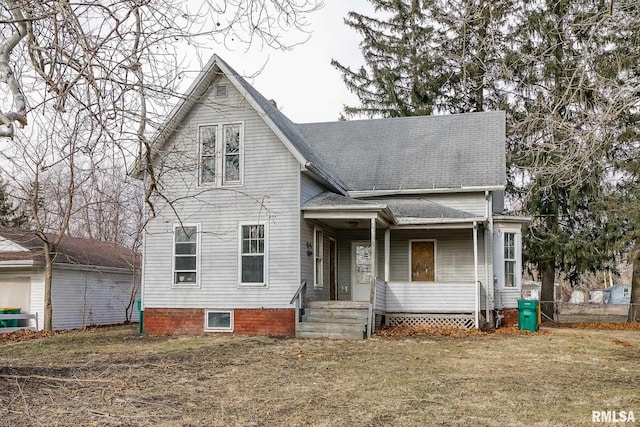 front of property with a porch and a front yard