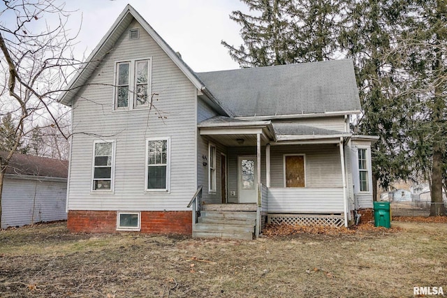 view of front property featuring a front lawn and a porch