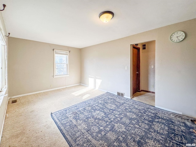 empty room featuring light carpet