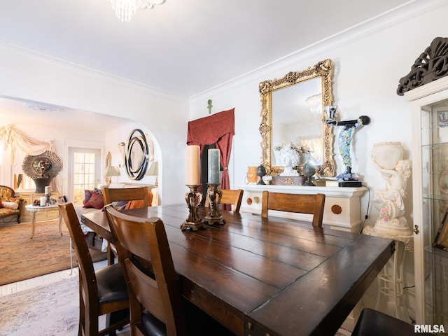 dining space with crown molding