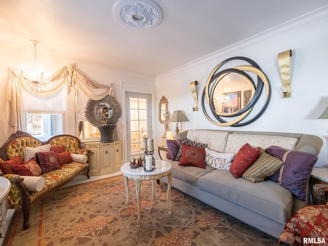 living room with an inviting chandelier and crown molding