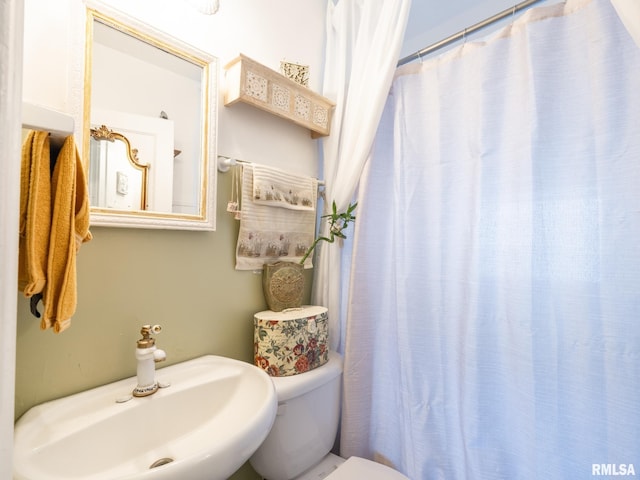 bathroom with sink and toilet