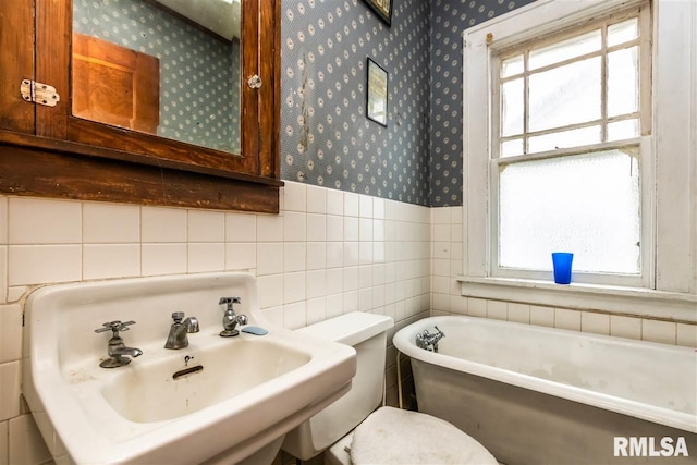 bathroom with a tub and sink