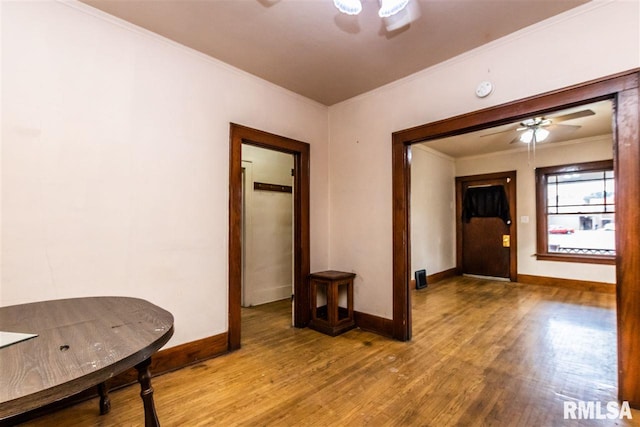 interior space featuring crown molding and hardwood / wood-style floors