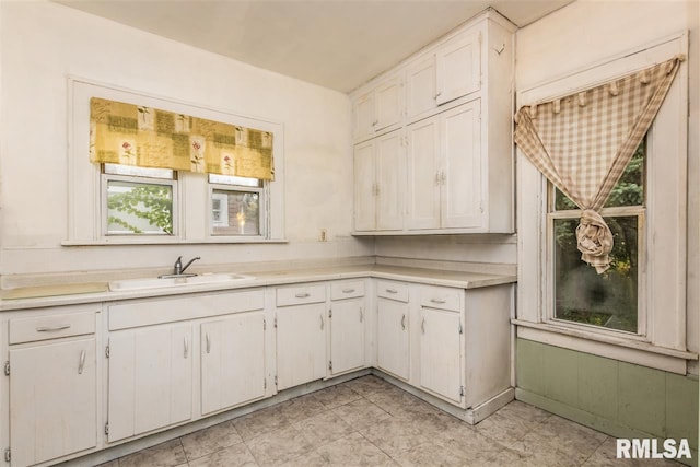 kitchen with sink and white cabinets