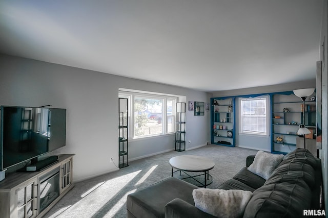 carpeted living room featuring a wealth of natural light