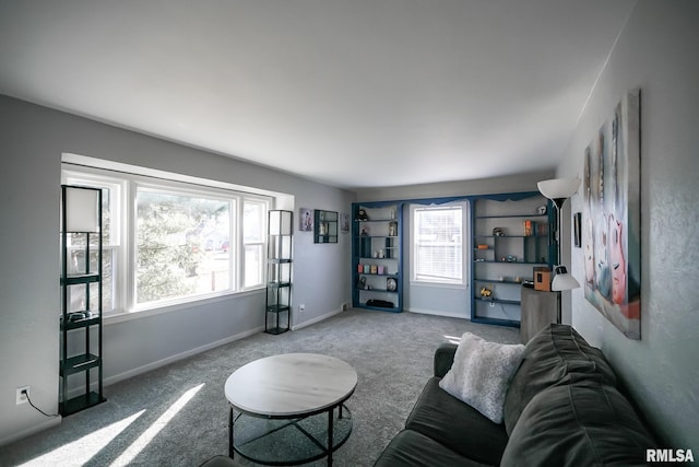 carpeted living room featuring plenty of natural light