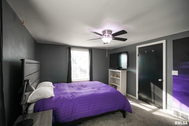 carpeted bedroom with ceiling fan