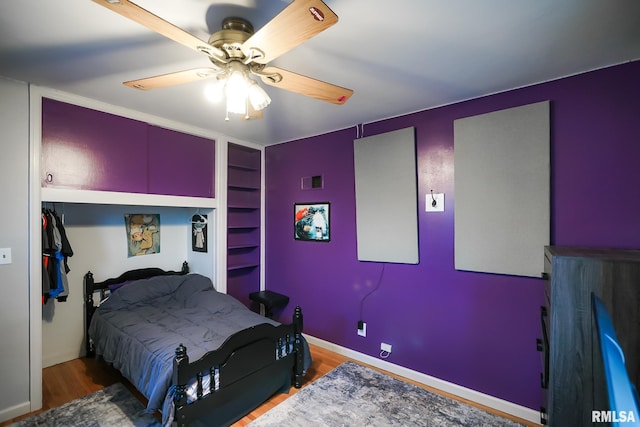 bedroom featuring ceiling fan and hardwood / wood-style flooring