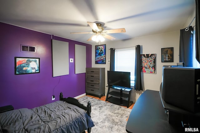 bedroom featuring ceiling fan and wood-type flooring