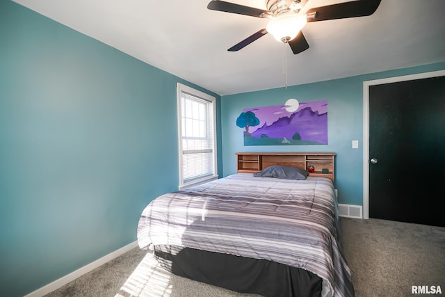 bedroom with ceiling fan and carpet