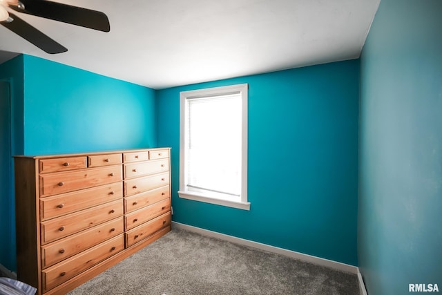 unfurnished bedroom with ceiling fan and carpet flooring