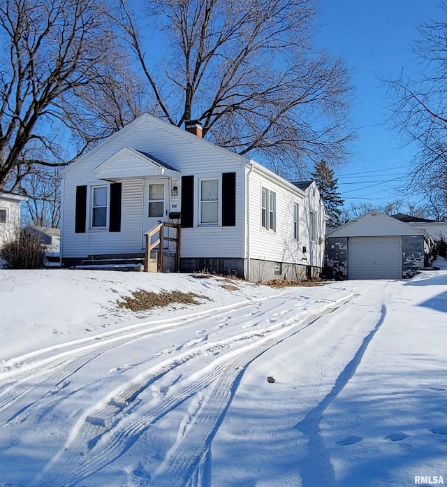 view of front of house with an outbuilding and a garage