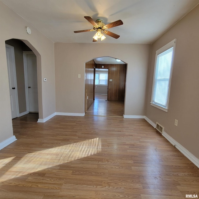 spare room featuring light hardwood / wood-style floors and ceiling fan