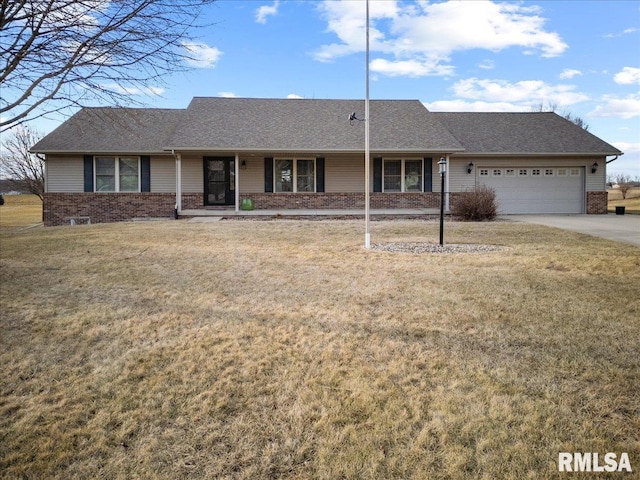 ranch-style home featuring a front yard and a garage