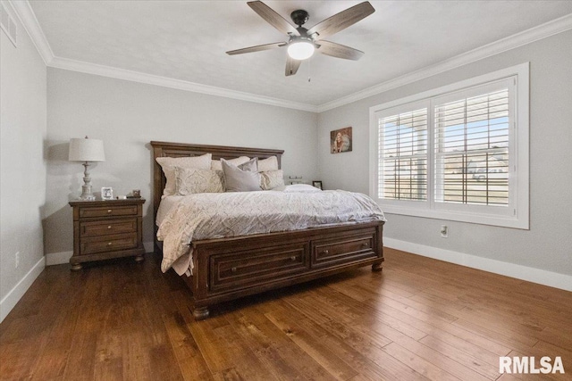 bedroom with ceiling fan, dark hardwood / wood-style floors, and crown molding