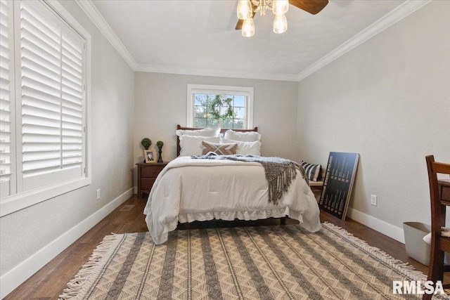 bedroom with ceiling fan, dark wood-type flooring, and crown molding