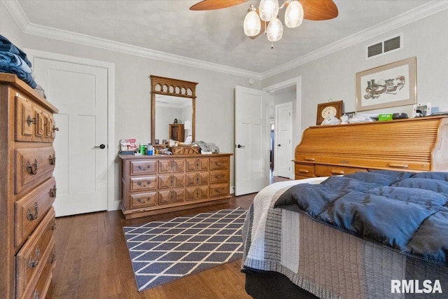 bedroom with ceiling fan, ornamental molding, and dark hardwood / wood-style flooring