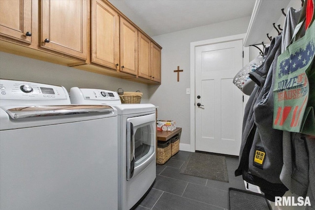 washroom with cabinets and washing machine and clothes dryer